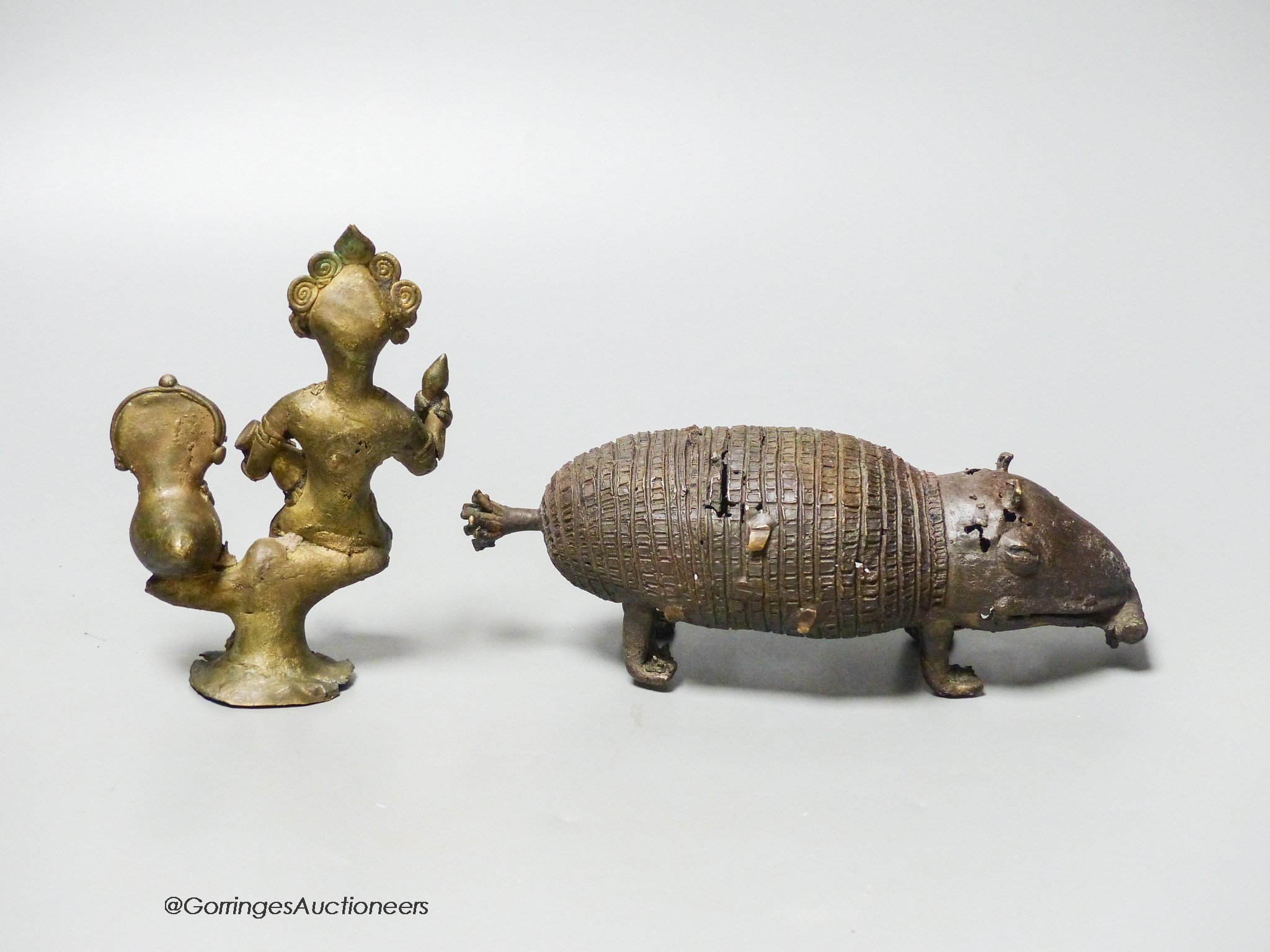 An Indian brass model of an armadillo and a similar figure